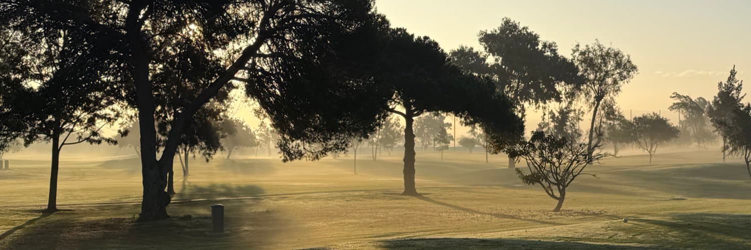 Golden morning light across a golf course